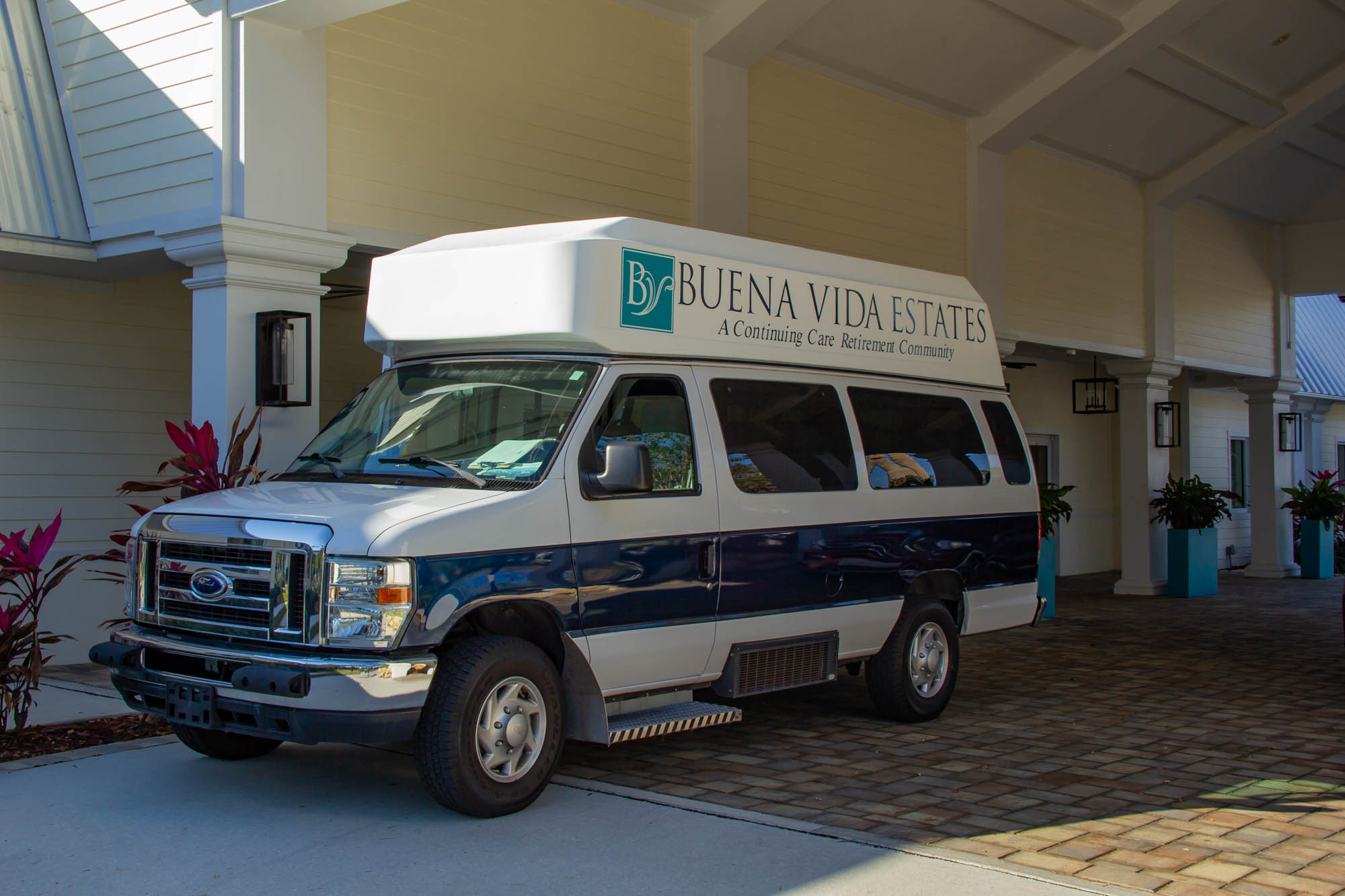 Buena Vida Estates entrance and transportation van