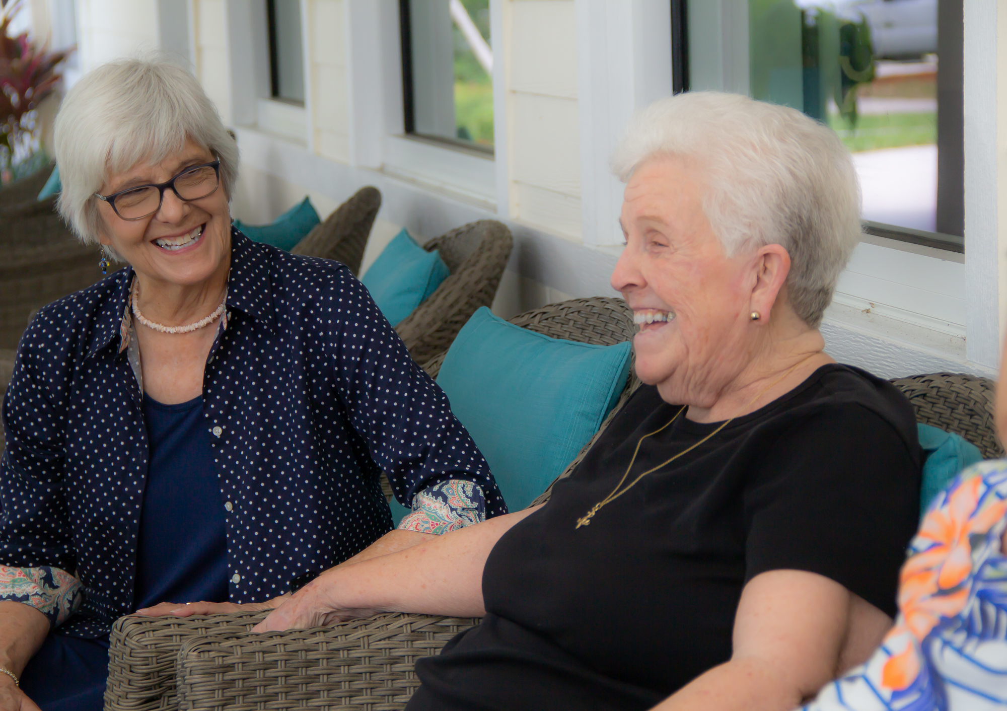 residents laughing together on patio