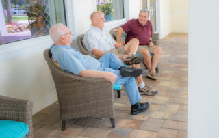 buena vida residents sitting on patio